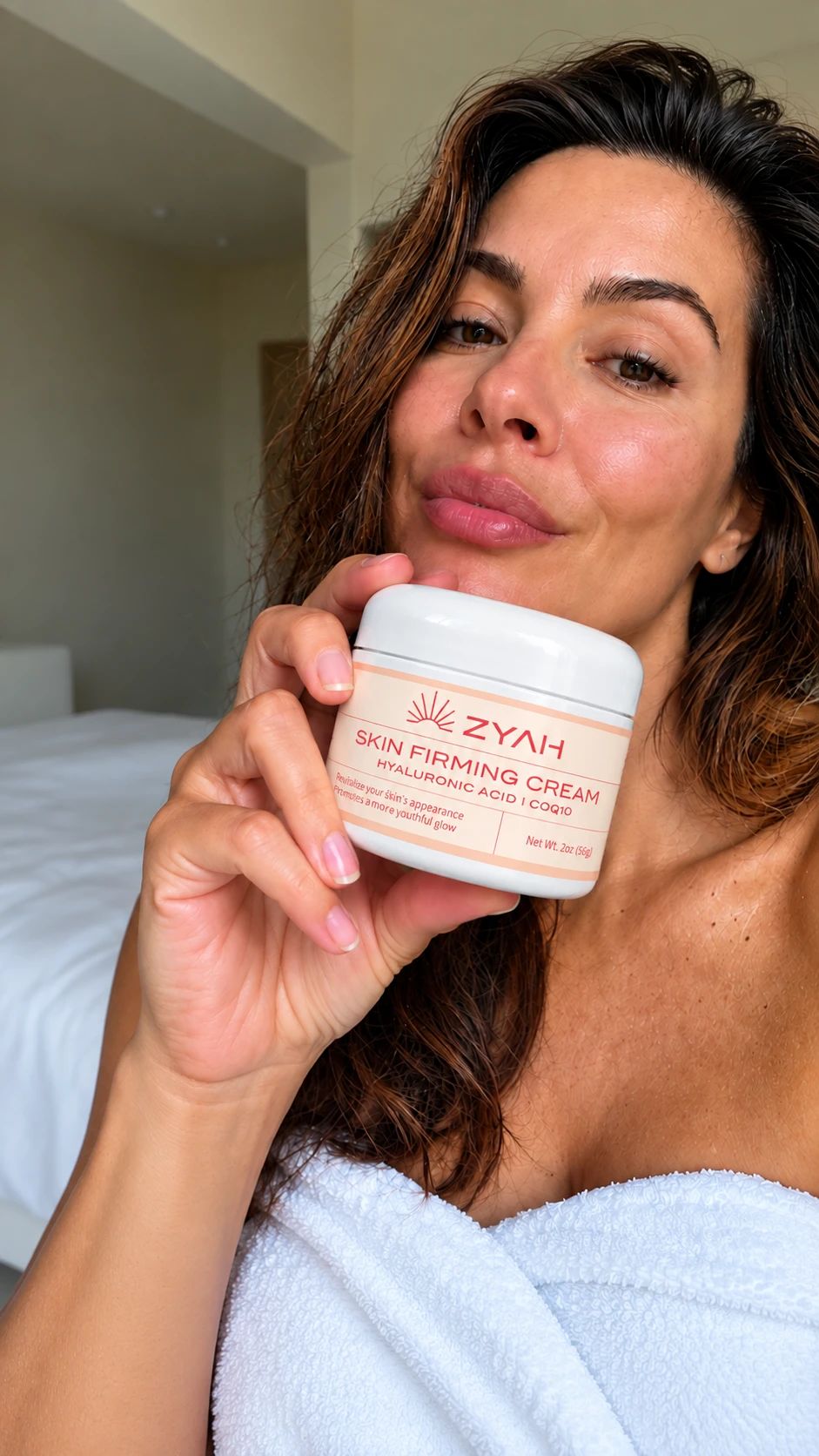Woman holding ZYAH Skin Firming Cream