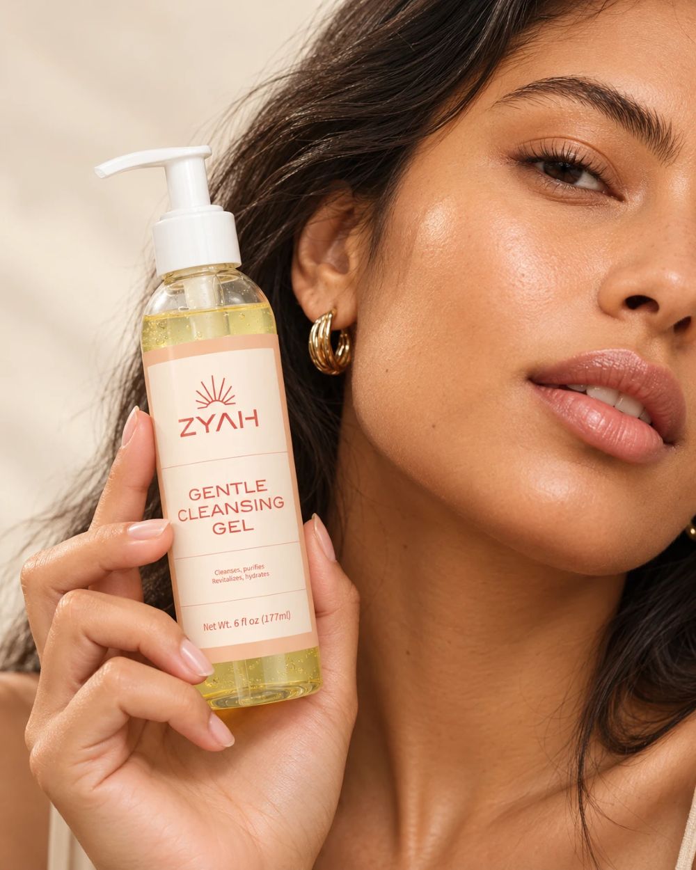 Model holding ZYAH Gentle Cleansing Gel